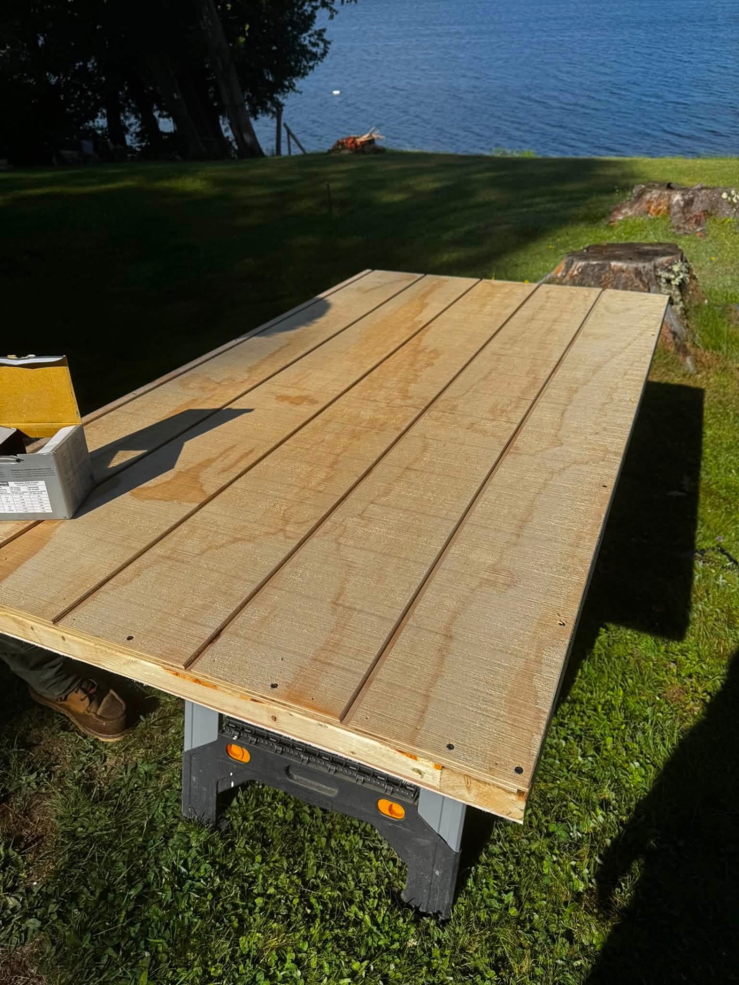New deck platform framed and sheathed with lakefront view