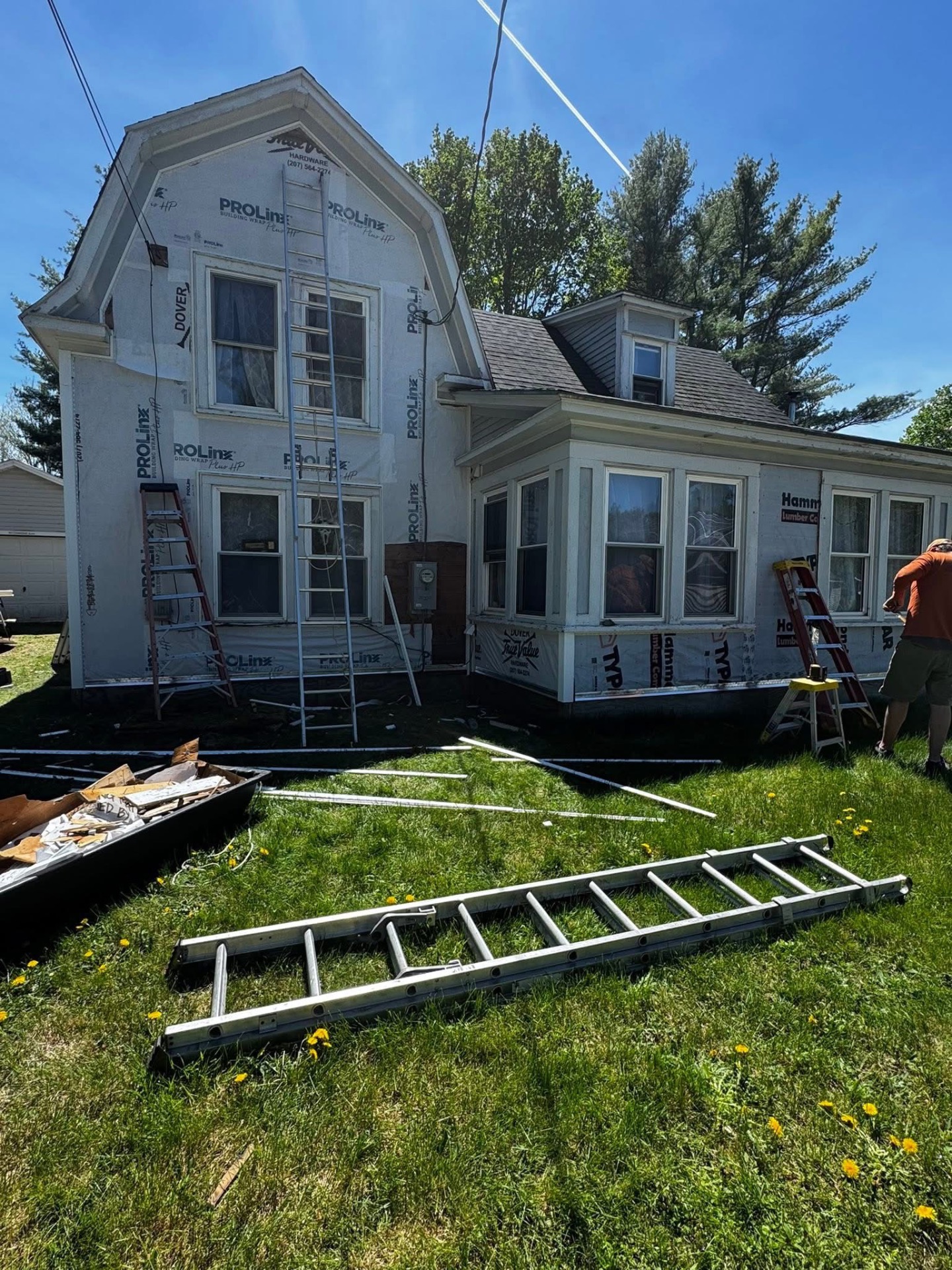 Home exterior wrapped in house wrap mid-siding replacement