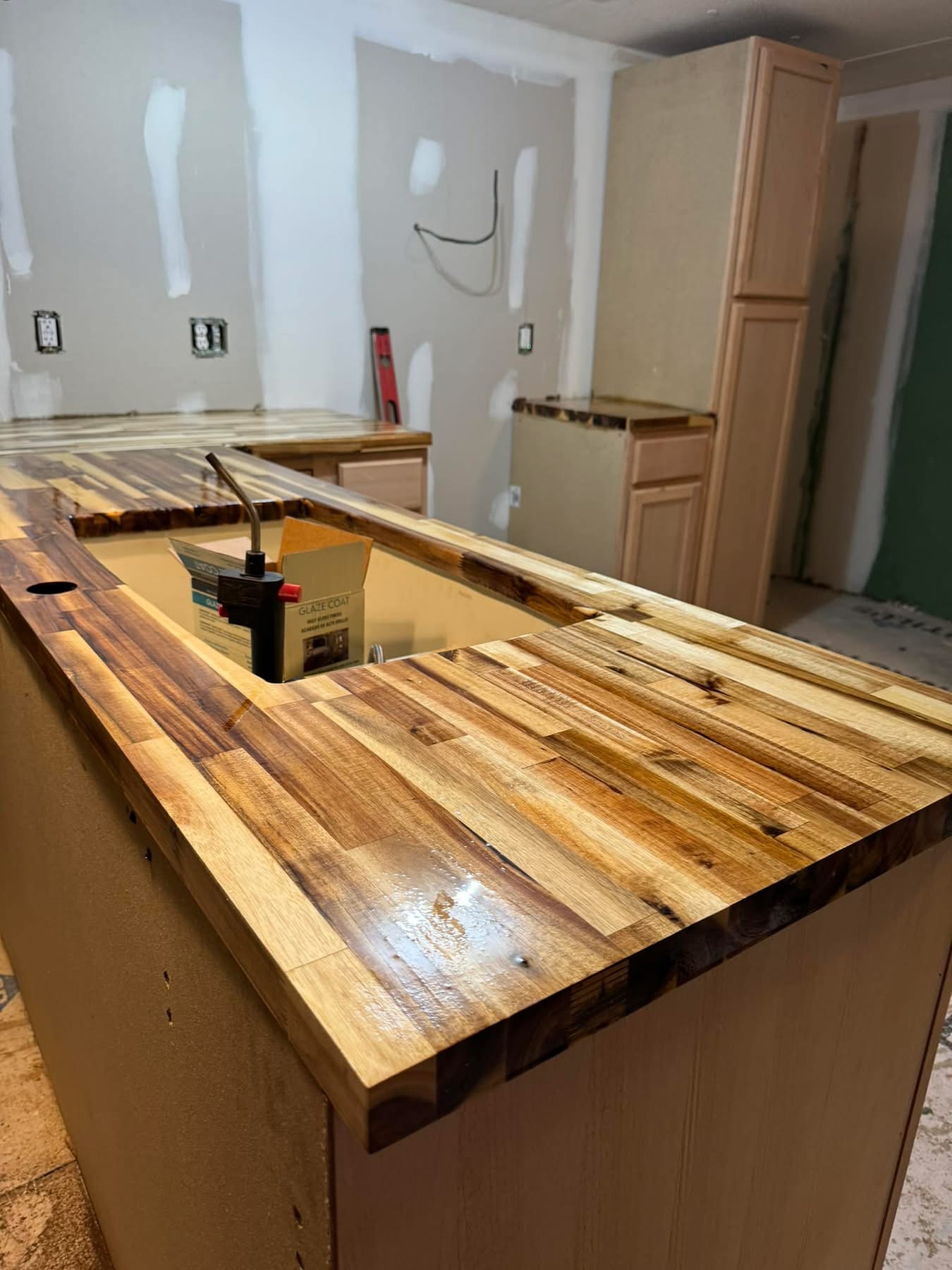 Live-edge butcher block bar counter installed during a kitchen remodel