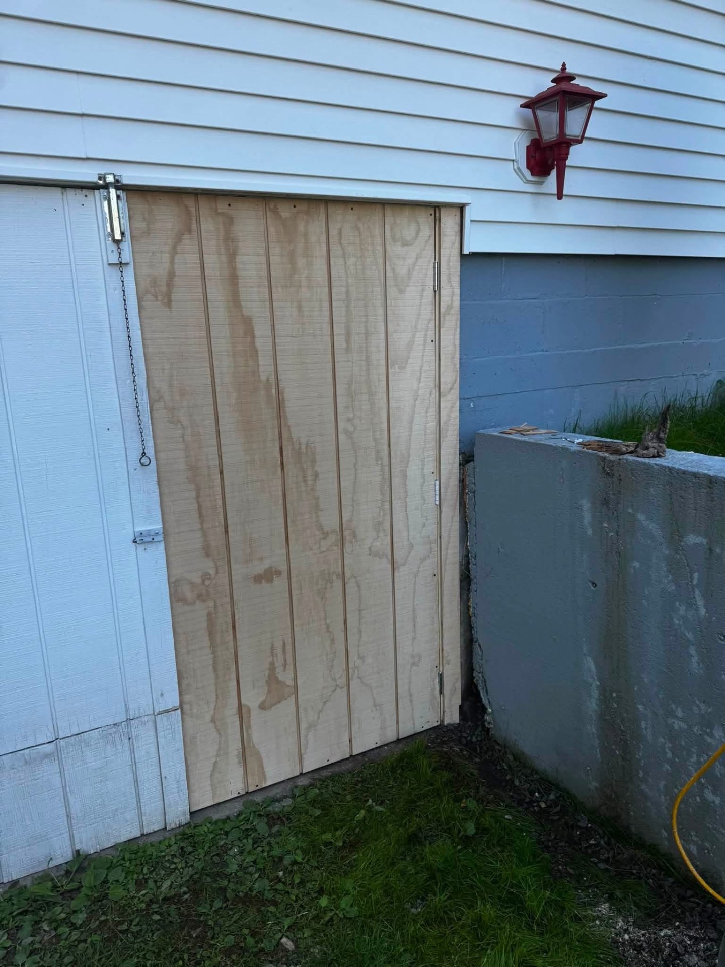 Custom-built exterior plywood bulkhead door